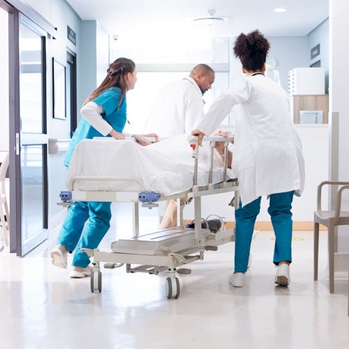 Medical, Stretcher, Patient Handling, Running, hospital and doctors with stretcher in hallway for emergency, surgery and help for medical service. Healthcare, icu and people rush with bed for accident, operation or surgical treatment